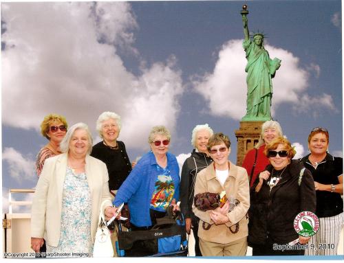 group with Statue of Liberty in background